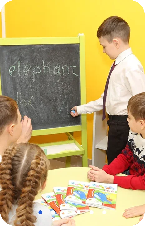 Children and their teacher discovering a book